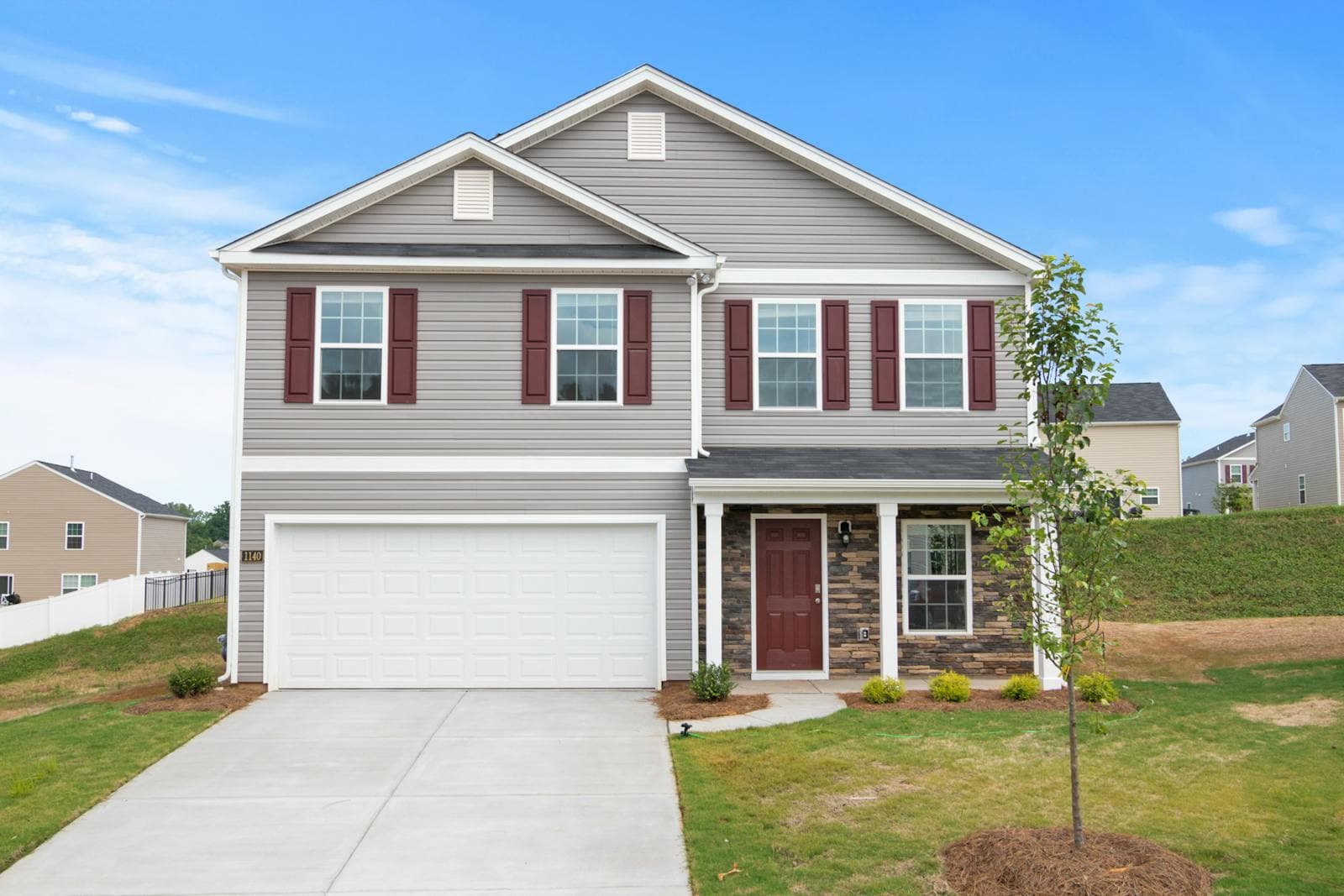 Older Carmichael ranch home with mature oak trees, well-maintained gutters, and fresh exterior paint