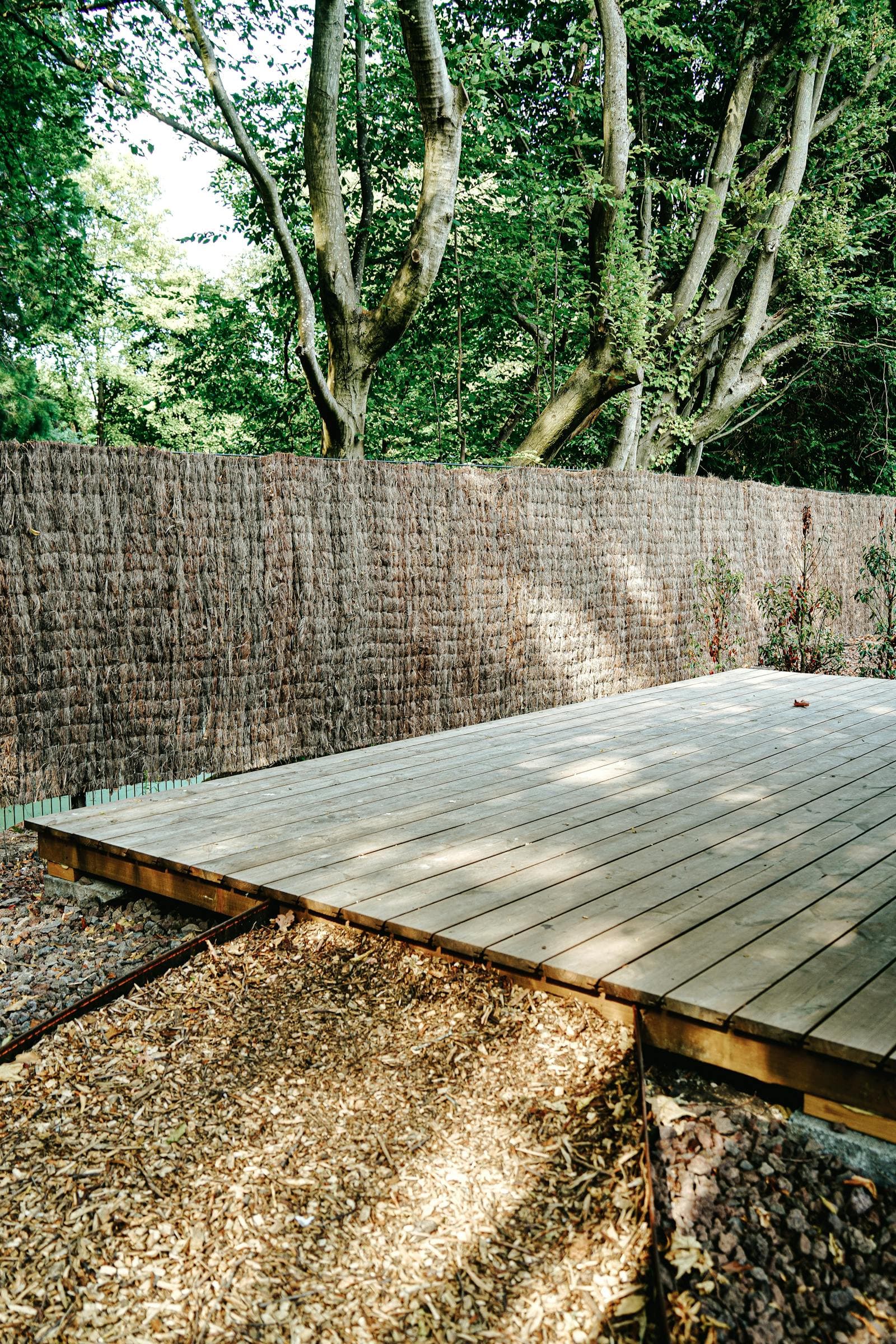 Restored wood deck with new railing and patio cover in a Sacramento backyard